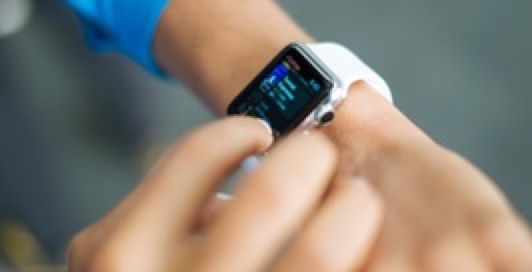Man tapping smart watch